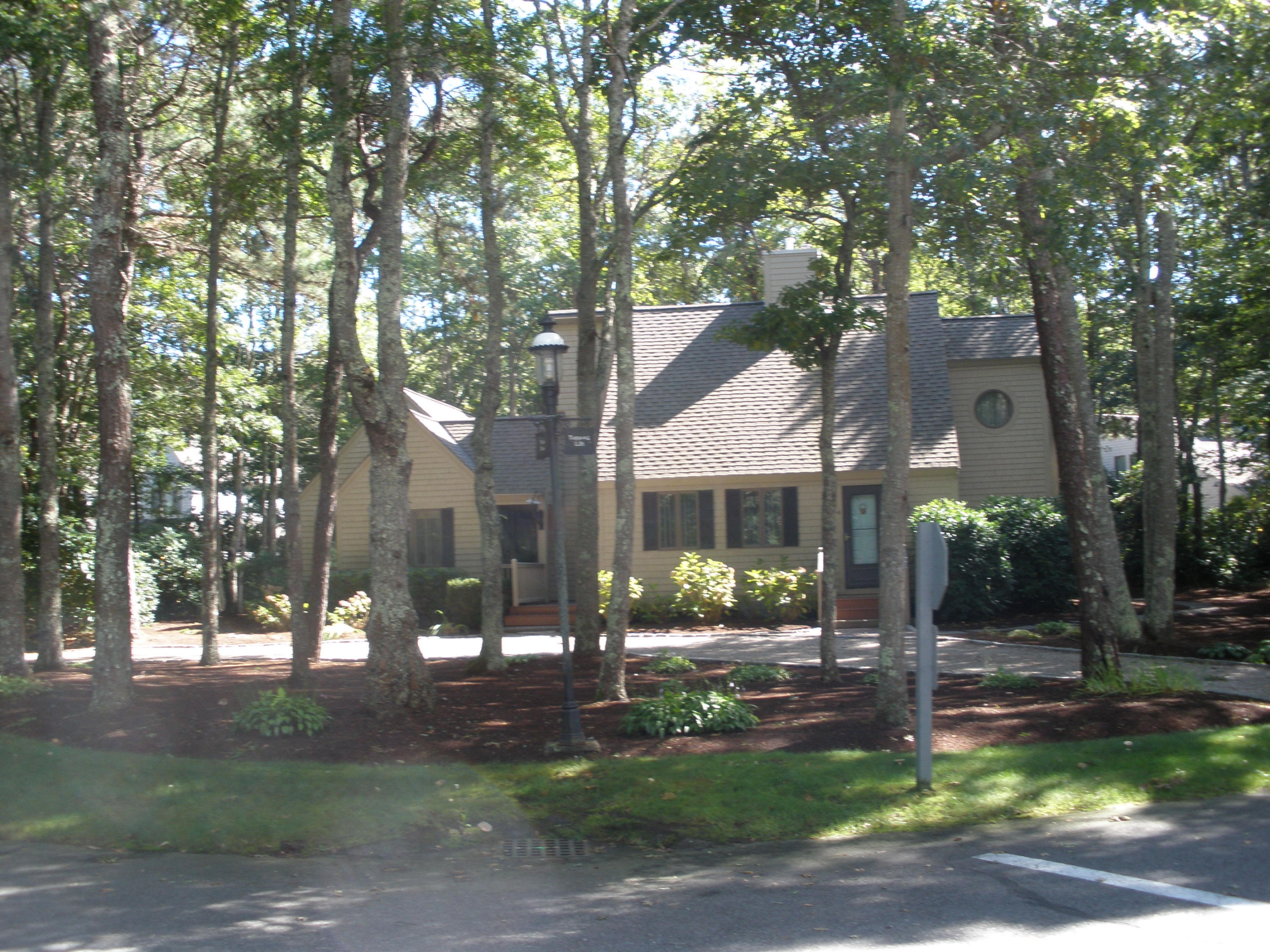 4 Topping Lift Mashpee, MA 02649 - Photo 1 of 24 a front view of a house with a garden