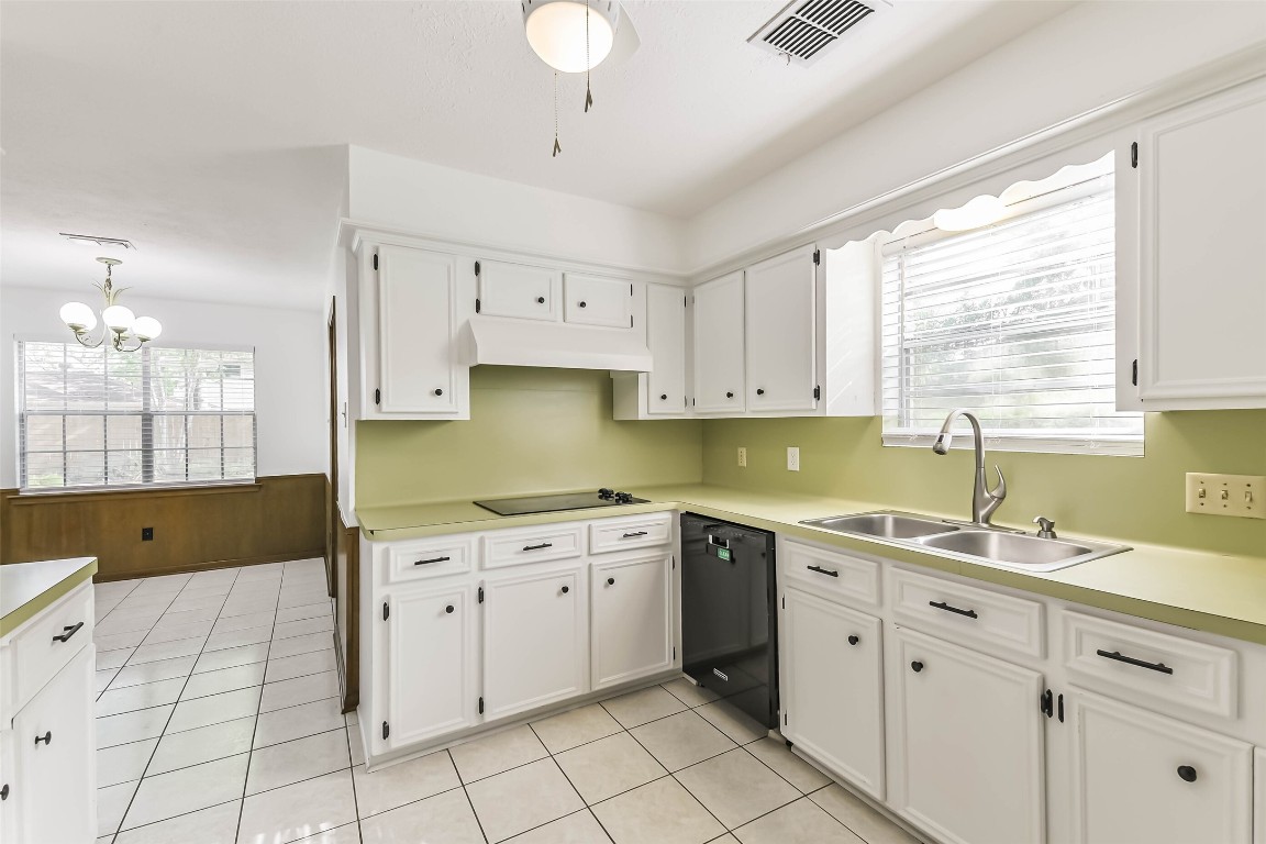 6915 Chancellor Drive Spring, TX 77379 - Photo 11 of 37 a kitchen with cabinets appliances and a window