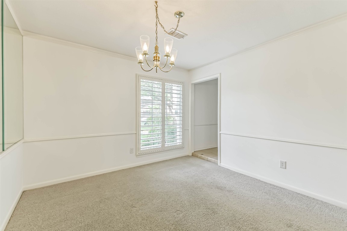 6915 Chancellor Drive Spring, TX 77379 - Photo 16 of 37 en empty room with windows and ceiling fan