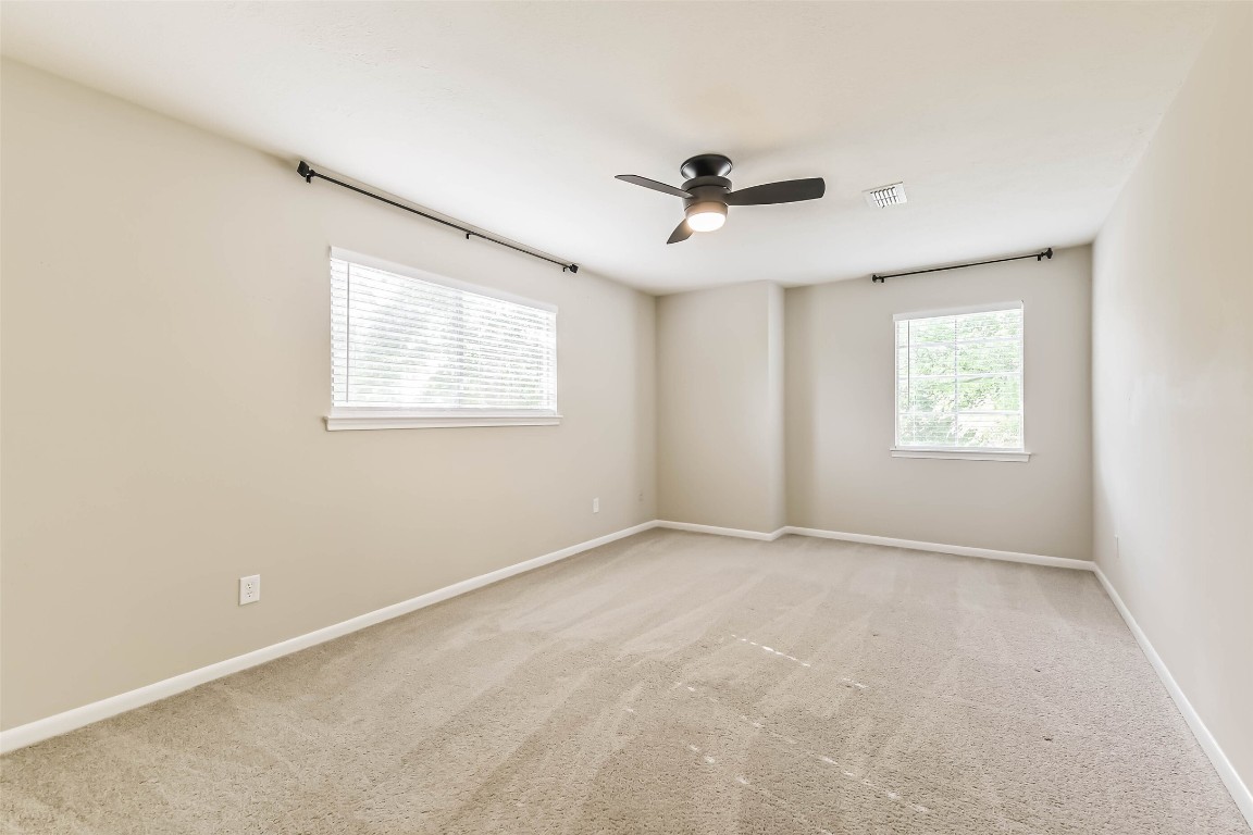 6915 Chancellor Drive Spring, TX 77379 - Photo 21 of 37 a view of an empty room with a window