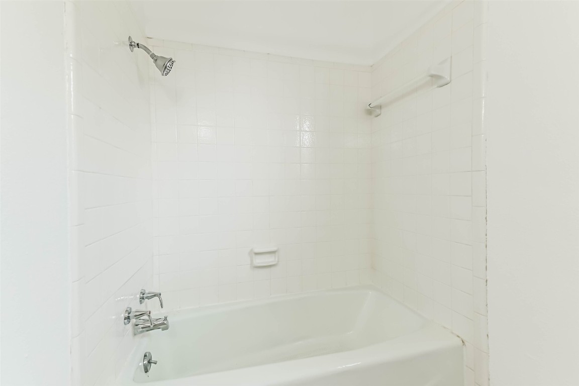 6915 Chancellor Drive Spring, TX 77379 - Photo 28 of 37 a bathroom with a bathtub