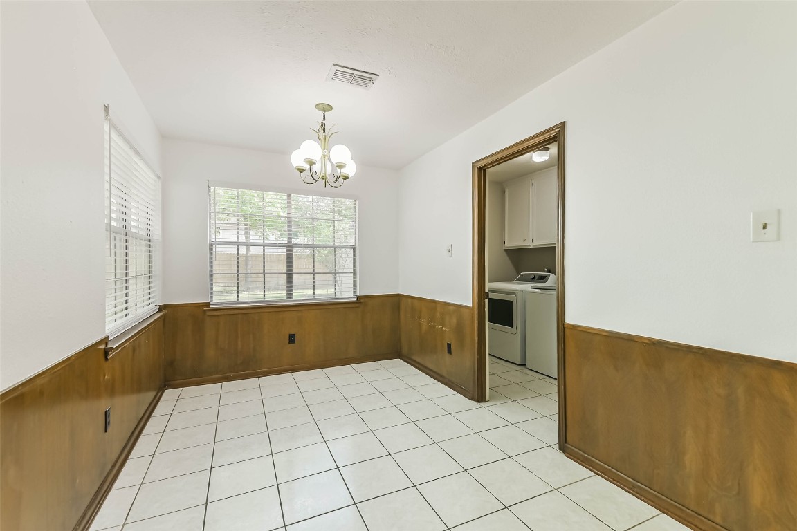 6915 Chancellor Drive Spring, TX 77379 - Photo 7 of 37 a kitchen with a cabinets and window
