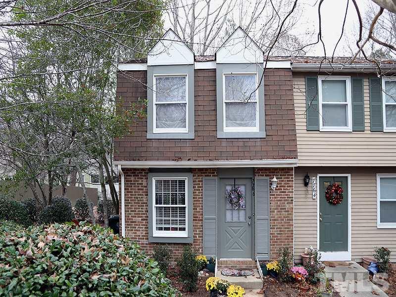a front view of a house with yard