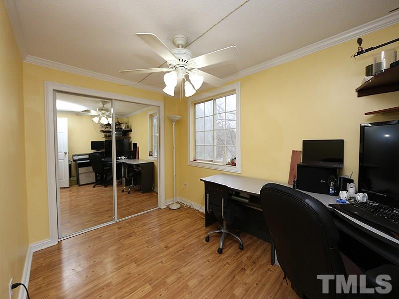 7766 Sandra Lane Raleigh, NC 27615 - Photo 12 of 14 a view of a workspace with furniture and a window