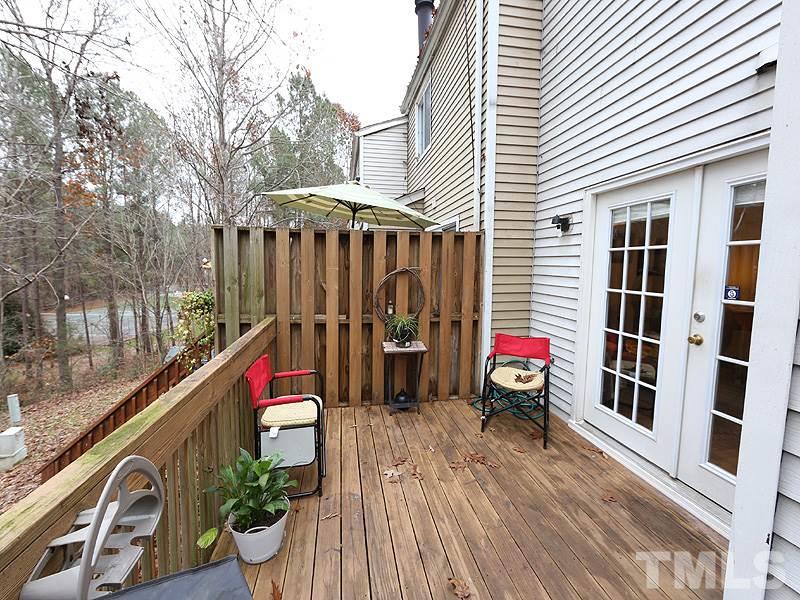 7766 Sandra Lane Raleigh, NC 27615 - Photo 13 of 14 a view of a balcony with two chairs and a table