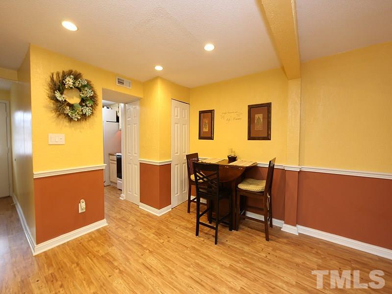 7766 Sandra Lane Raleigh, NC 27615 - Photo 6 of 14 a view of a workspace room with wooden floor and furniture