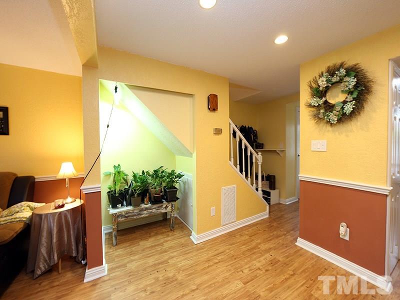 7766 Sandra Lane Raleigh, NC 27615 - Photo 9 of 14 a view of a couches and dinning table in a room
