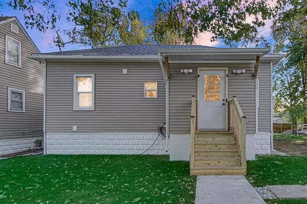 a front view of a house with garden