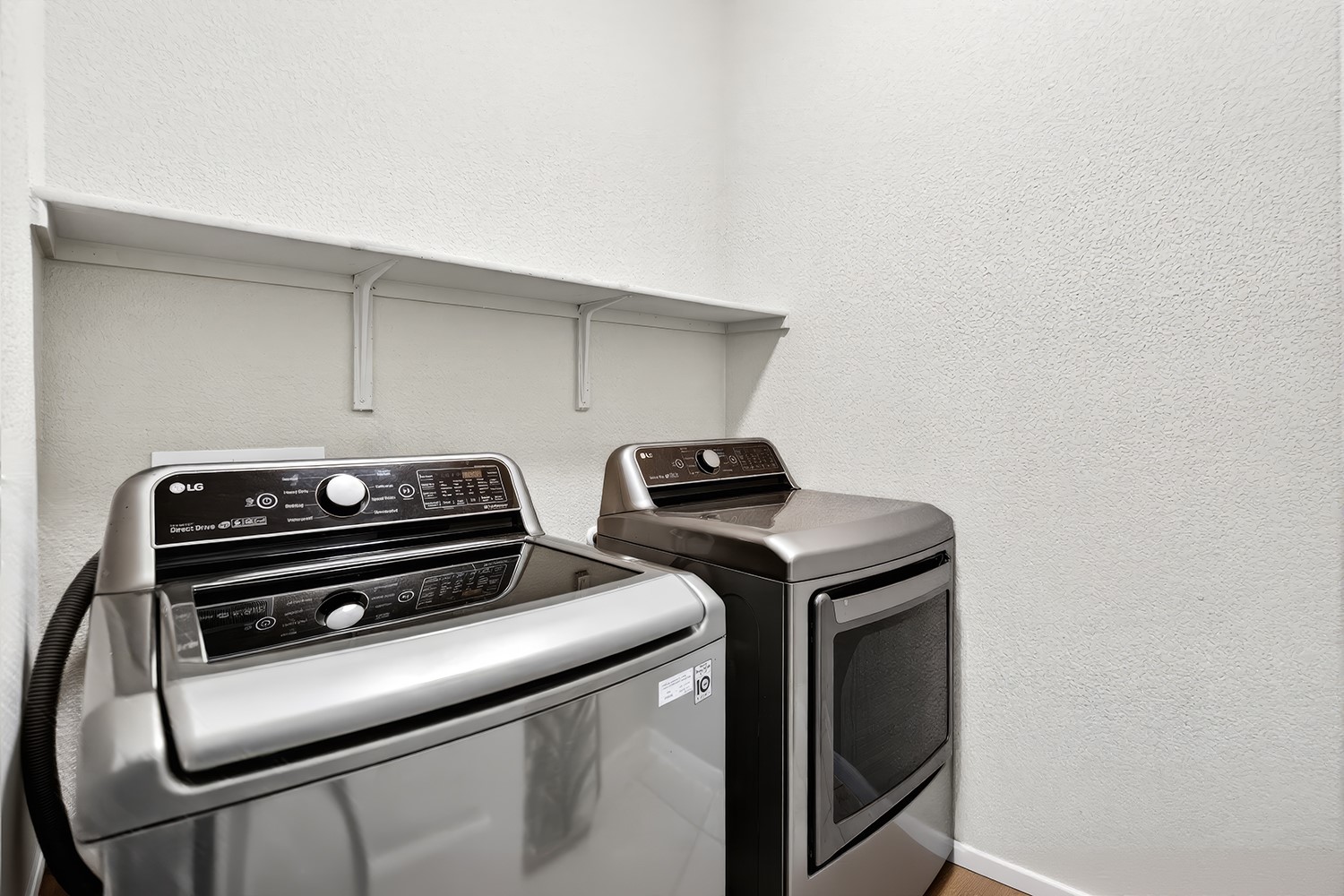 2006 Grow Lane Austin, TX 78754 - Photo 16 of 40 Streamlined laundry area with a practical shelf provides effortless home management.