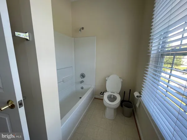 a bathroom with a sink and a window