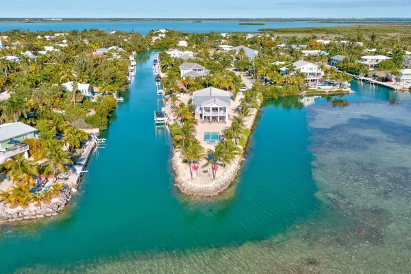 an aerial view of a house with a lake view