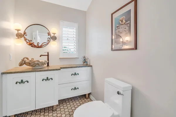 a view of swimming pool with a table and chairs under an umbrella