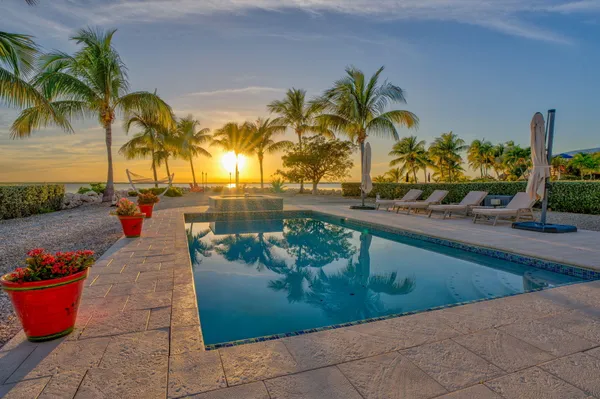 a view of a backyard with sitting area