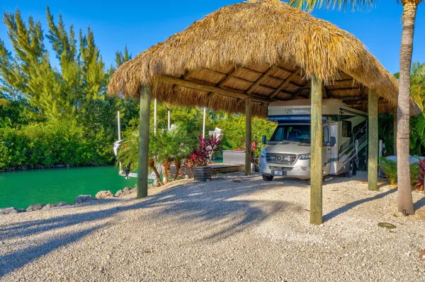 an aerial view of a houses with a lake view