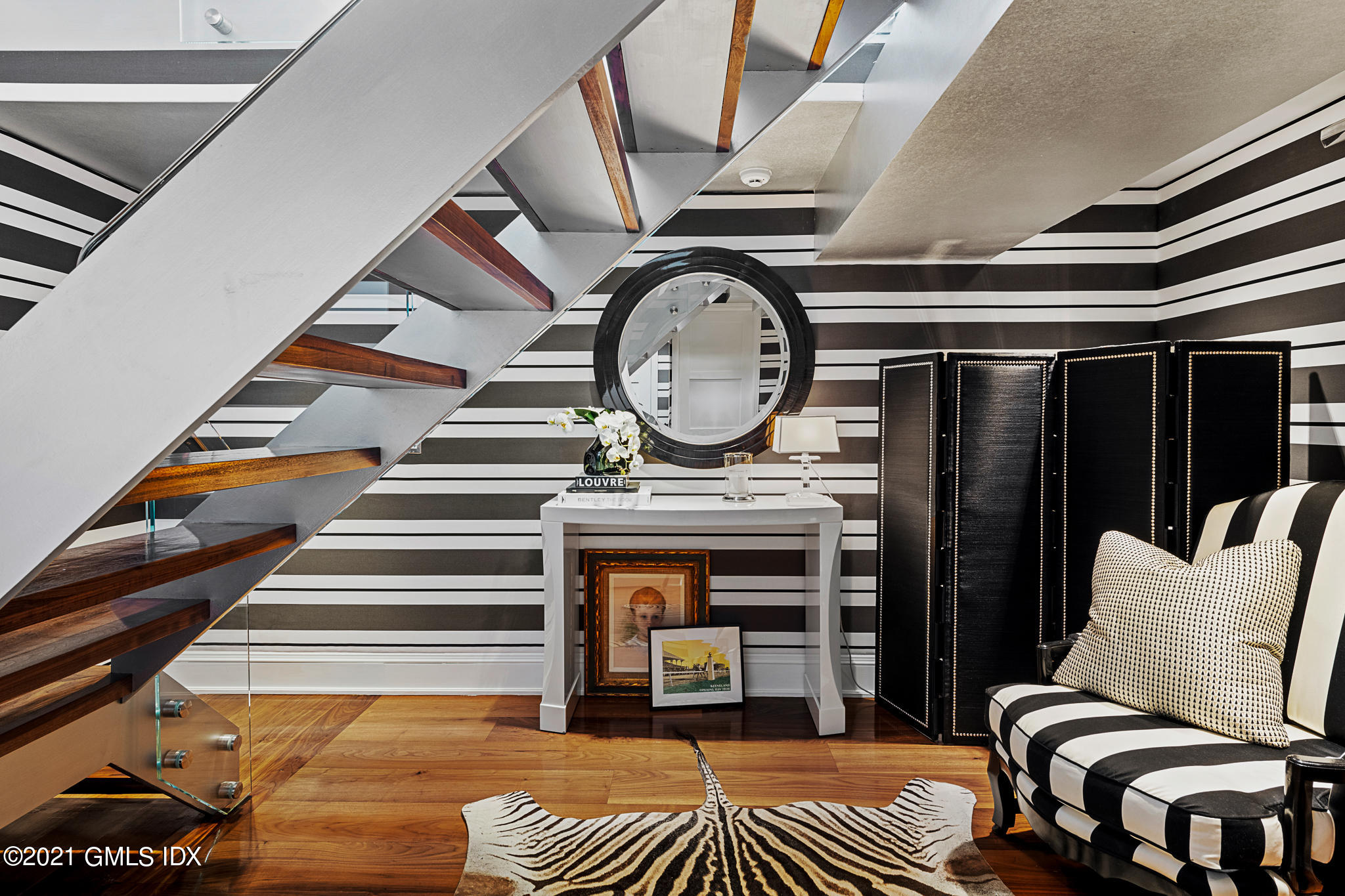 55 Byram Shore Road Greenwich, CT 06830 - Photo 11 of 30 a view of a livingroom with furniture and staircase