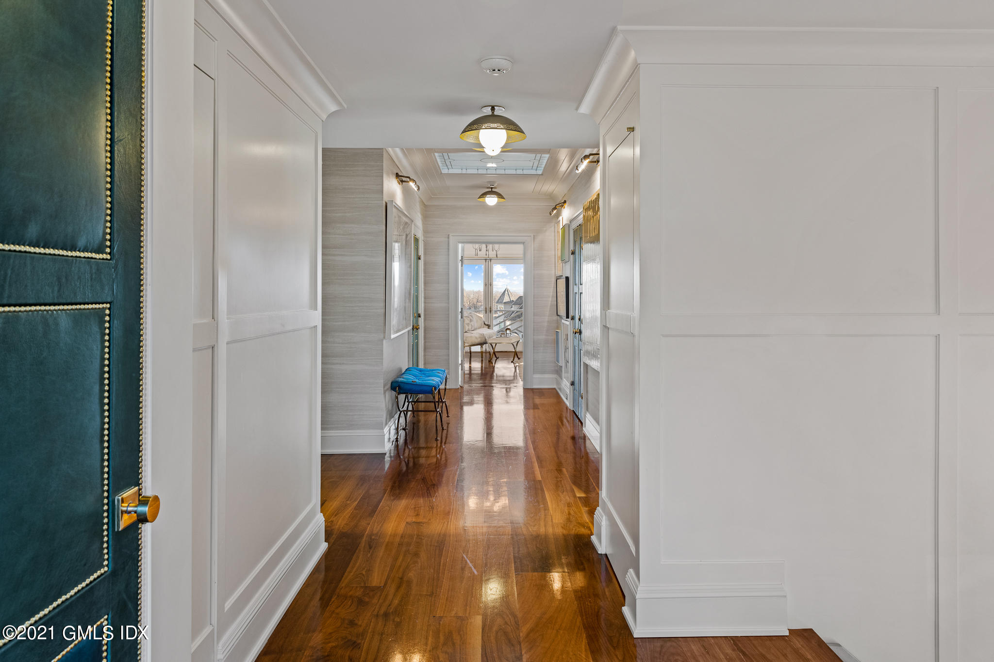 55 Byram Shore Road Greenwich, CT 06830 - Photo 12 of 30 a view of a hallway with wooden floor windows and livingroom