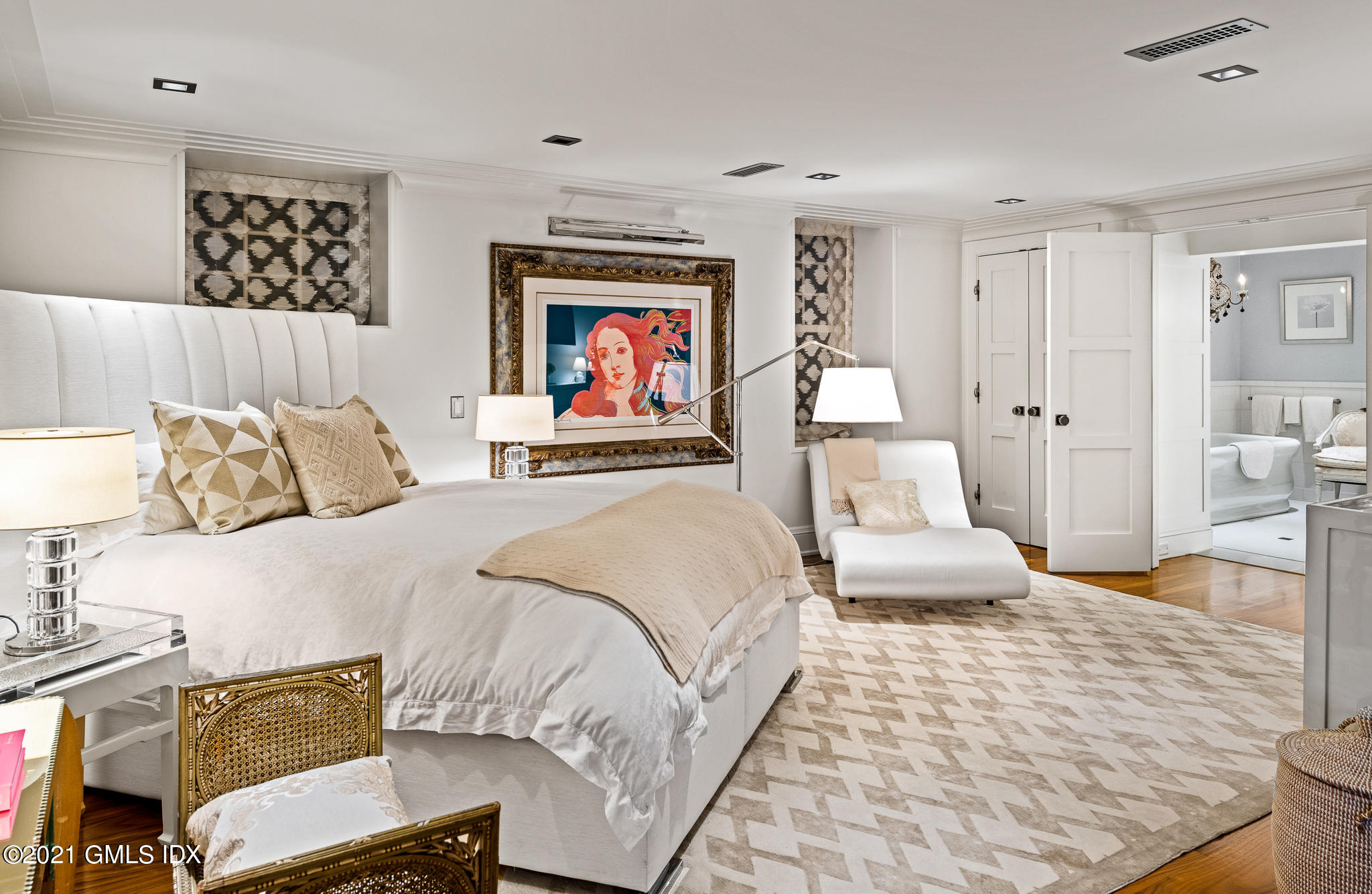 55 Byram Shore Road Greenwich, CT 06830 - Photo 18 of 30 a bedroom with a bed and a couch