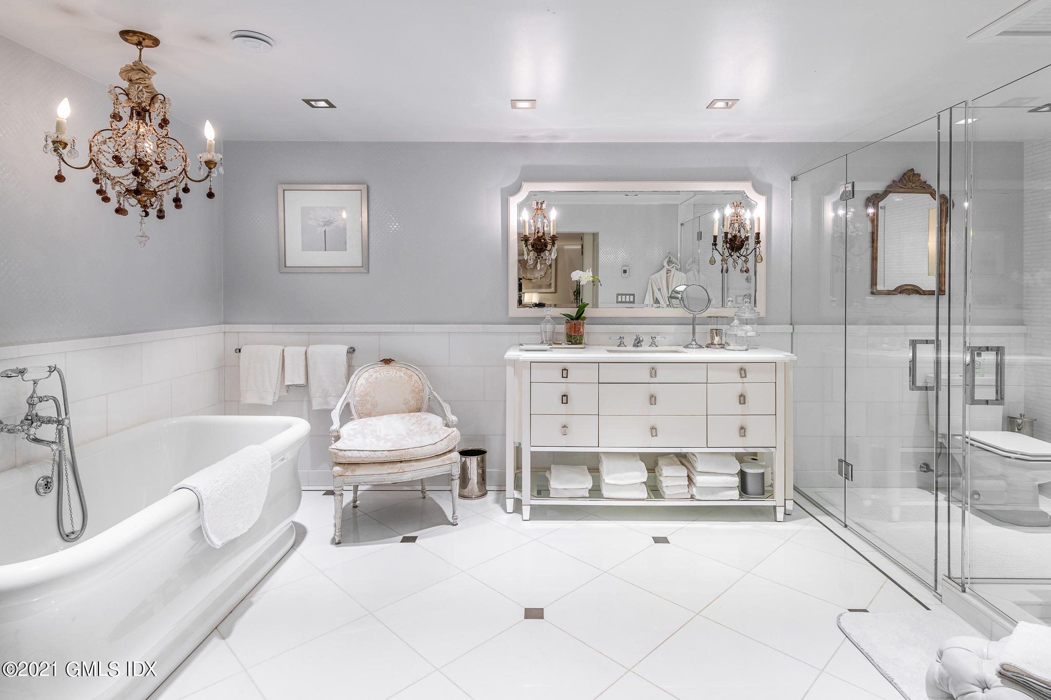 55 Byram Shore Road Greenwich, CT 06830 - Photo 19 of 30 a bathroom with a sink mirror and toilet