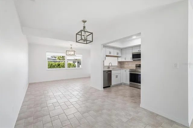 a view of a kitchen with a sink cabinets and window