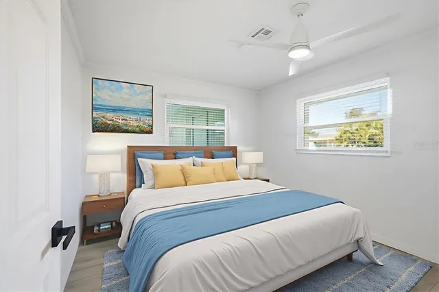 a bedroom with a bed and a window