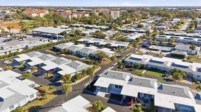 a view of a swimming pool with a yard