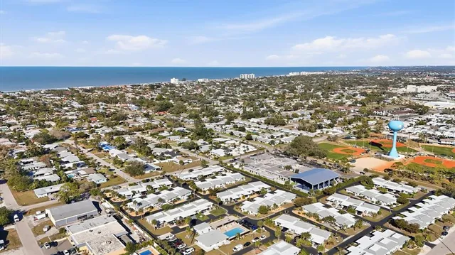 a view of a living room and kitchen