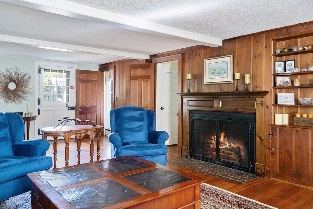 8 Nob Hill Road Wayland, MA 01778 - Photo 14 of 28 a living room with furniture a flat screen tv and a fireplace