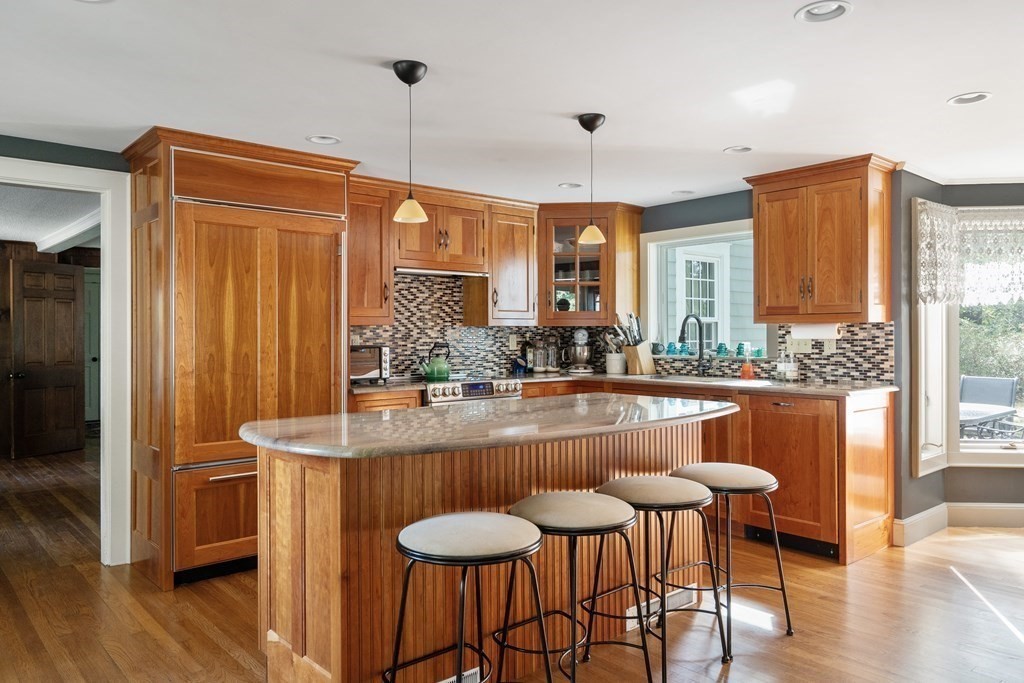 8 Nob Hill Road Wayland, MA 01778 - Photo 6 of 28 a dining table chairs and a chandelier
