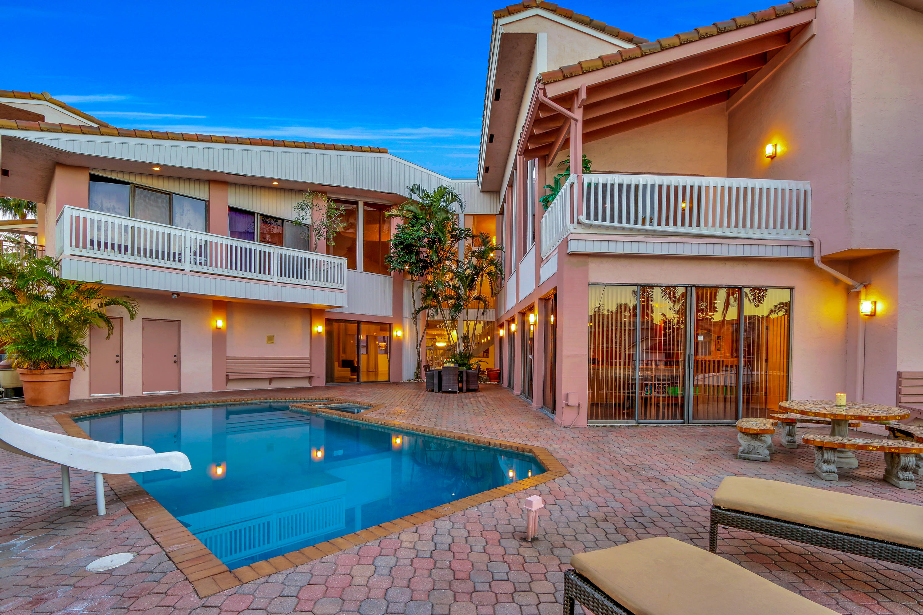 1583 Southwest 6th Terrace Boca Raton, FL 33486 - Photo 26 of 36 a view of a patio with swimming pool table and chairs