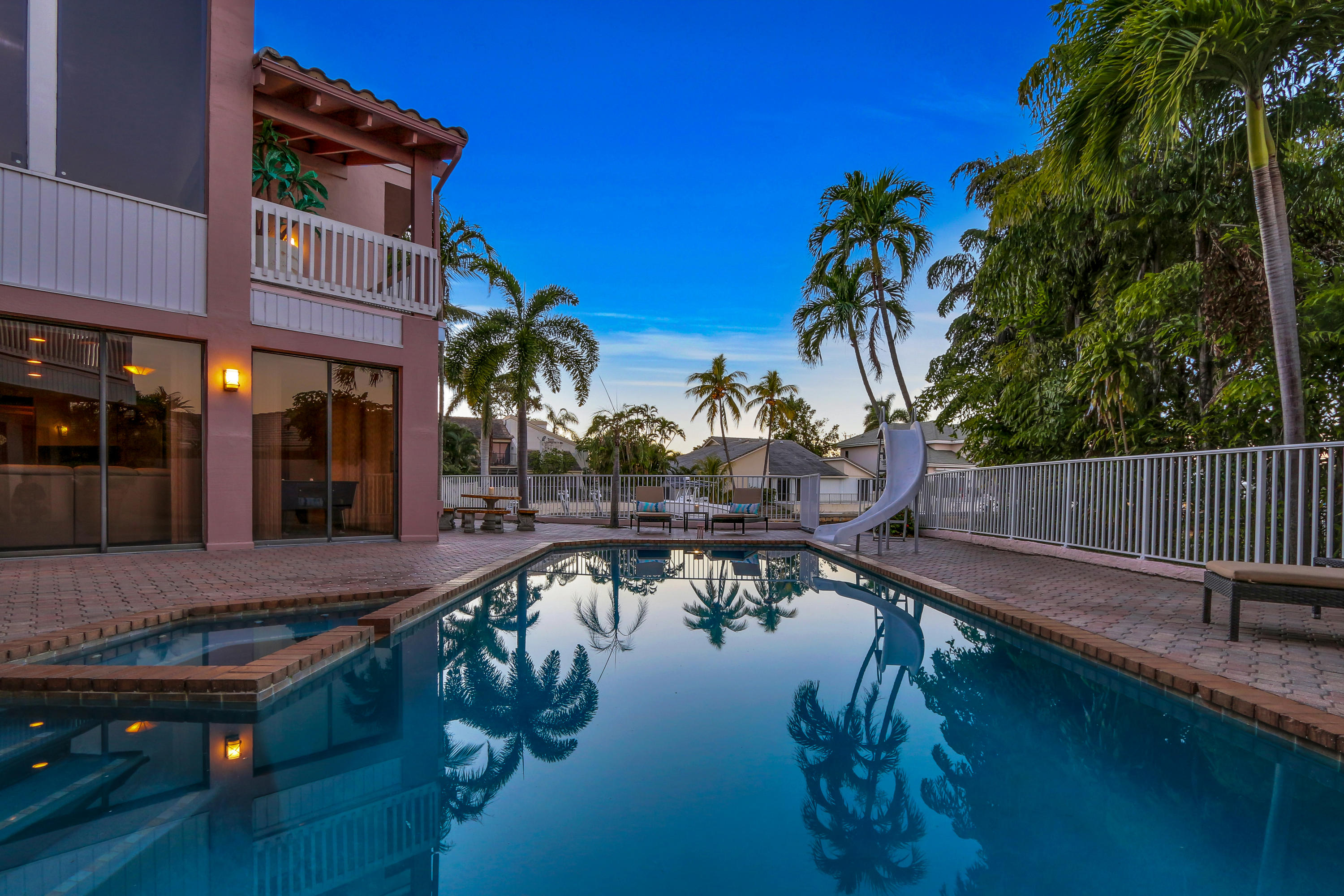 1583 Southwest 6th Terrace Boca Raton, FL 33486 - Photo 5 of 36 a swimming pool with outdoor seating and yard