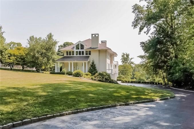 51 Turkey Hill Road South Westport, CT 06880 - Photo 1 of 1 a front view of a house with a yard