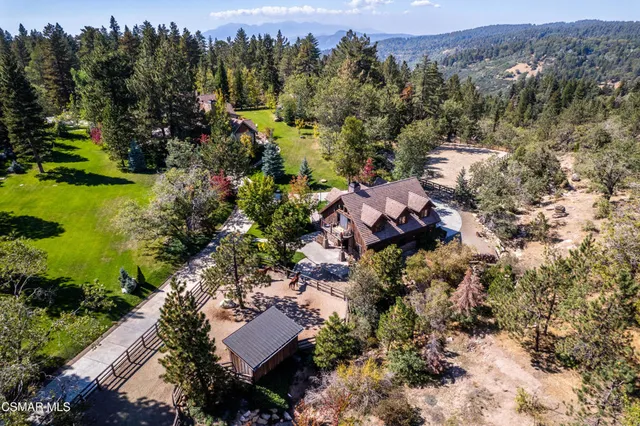 an aerial view of residential house with outdoor space