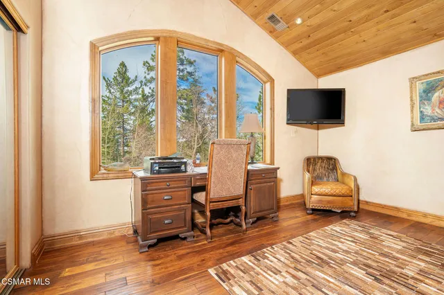 a bedroom with a bed and a fireplace