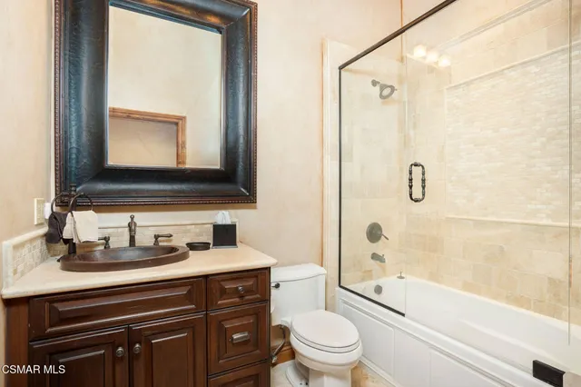 a living room with furniture a fireplace and a projector