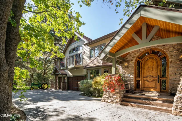 a view of a house with a tree