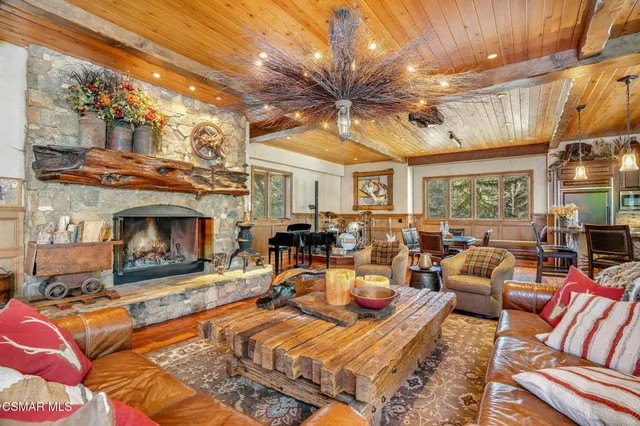 a bedroom with a bed and a flat tv screen on dresser
