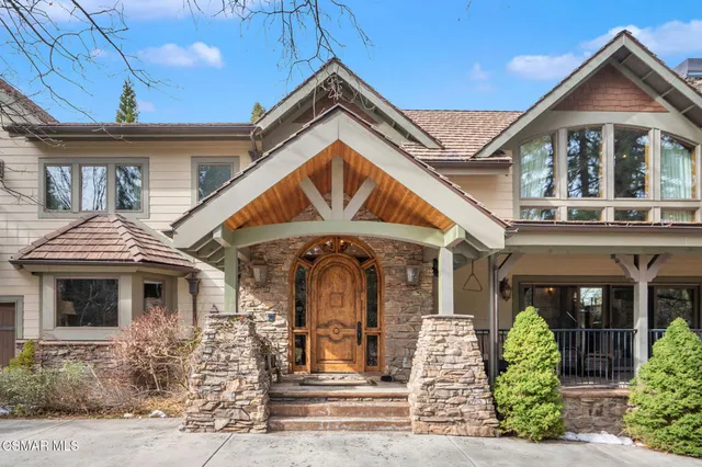 a living room with furniture a lamp and a fireplace