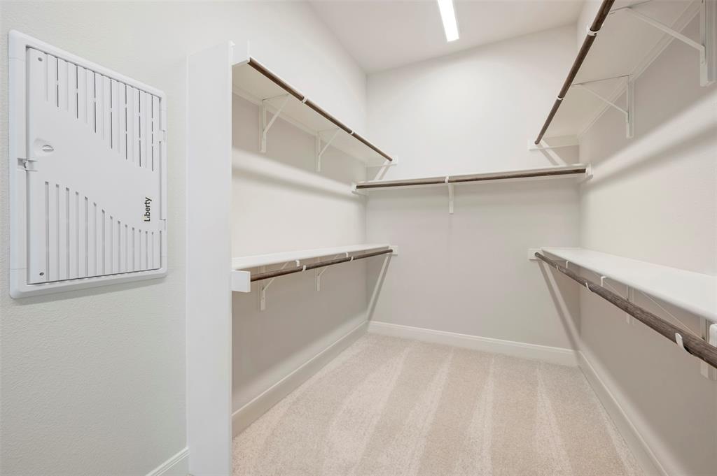3575 Redbud Flower Trail Venus, TX 76084 - Photo 35 of 36 Walk in closet featuring light carpet