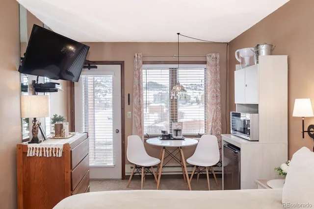 a view of a dining room with furniture window and outside view