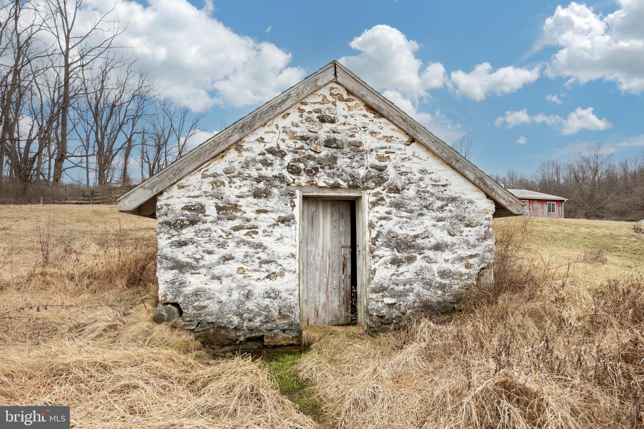 a view of a wooden door with a yard