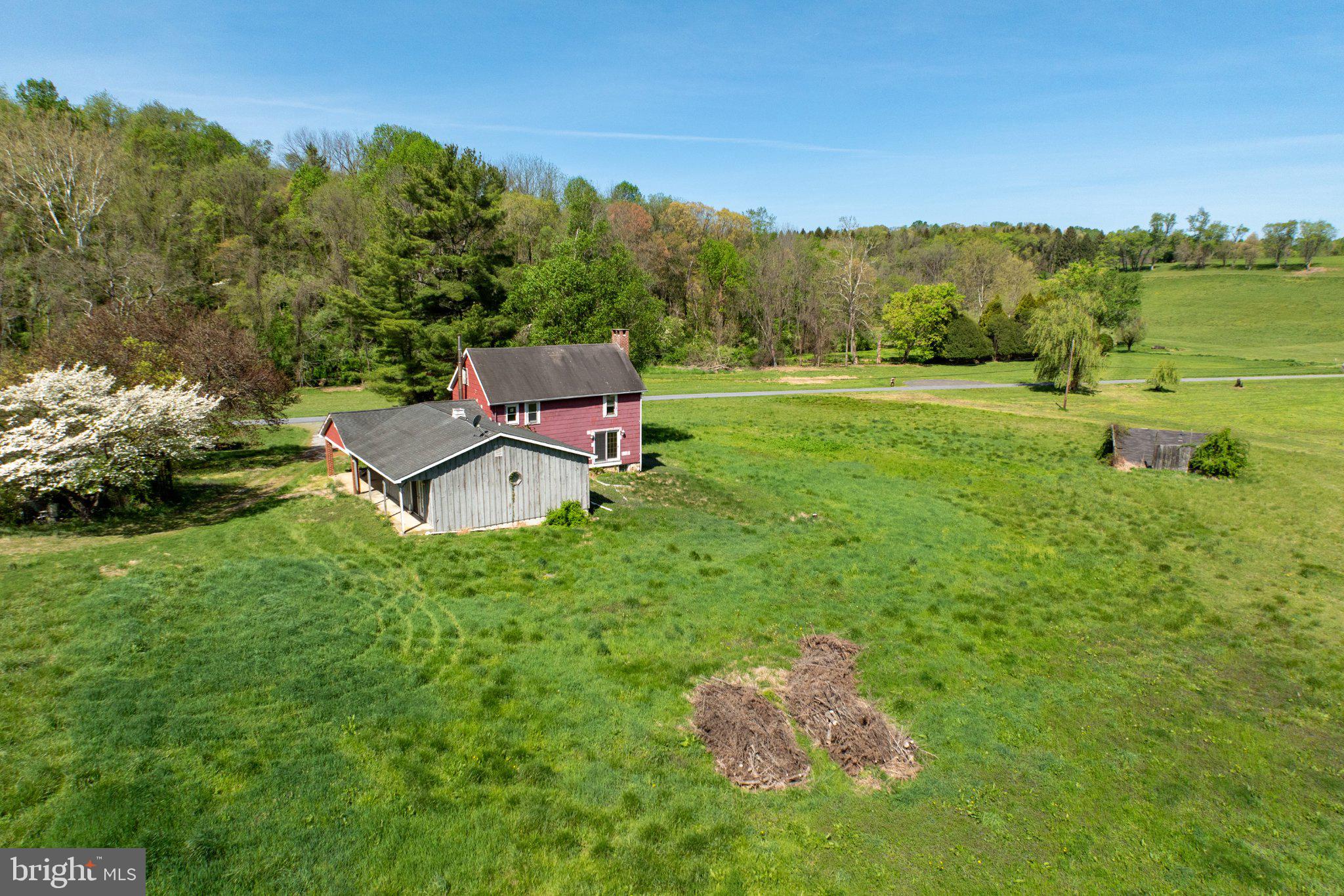 380 Glen Roy Road Nottingham, PA 19362 - Photo 2 of 45 Charming farmhouse amid lush greenery.