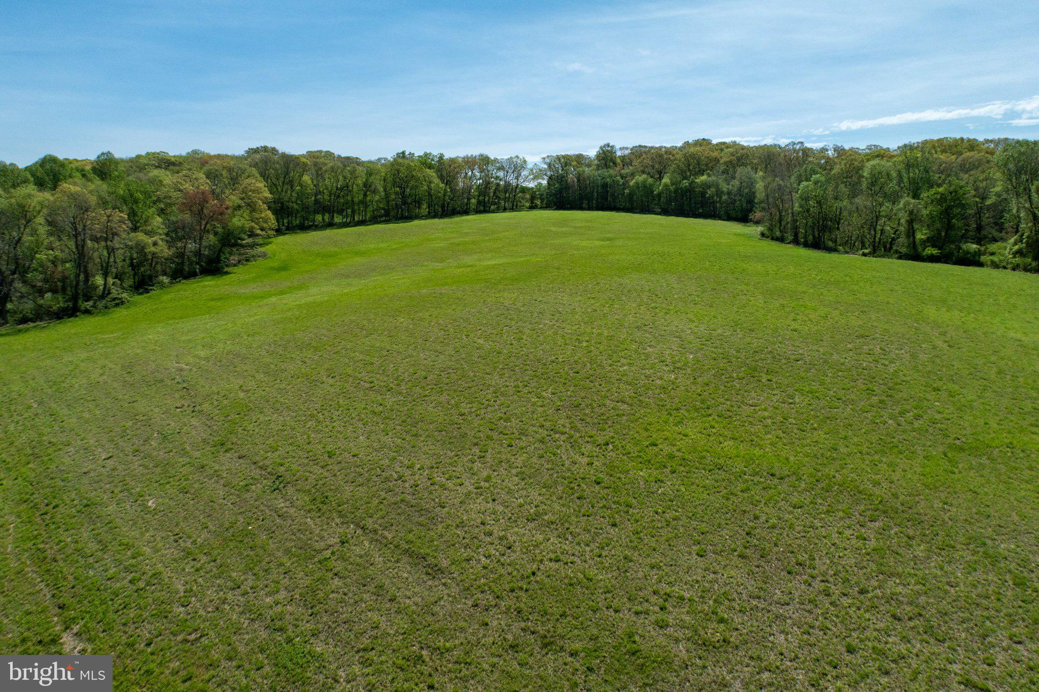 380 Glen Roy Road Nottingham, PA 19362 - Photo 34 of 45 Vast green expanse under blue skies.