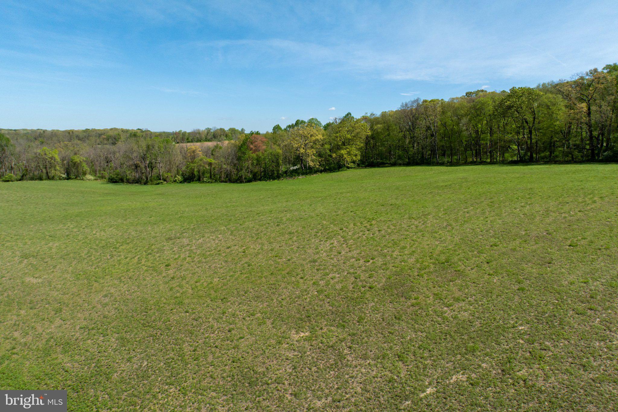 380 Glen Roy Road Nottingham, PA 19362 - Photo 41 of 45 Expansive green fields under blue skies.