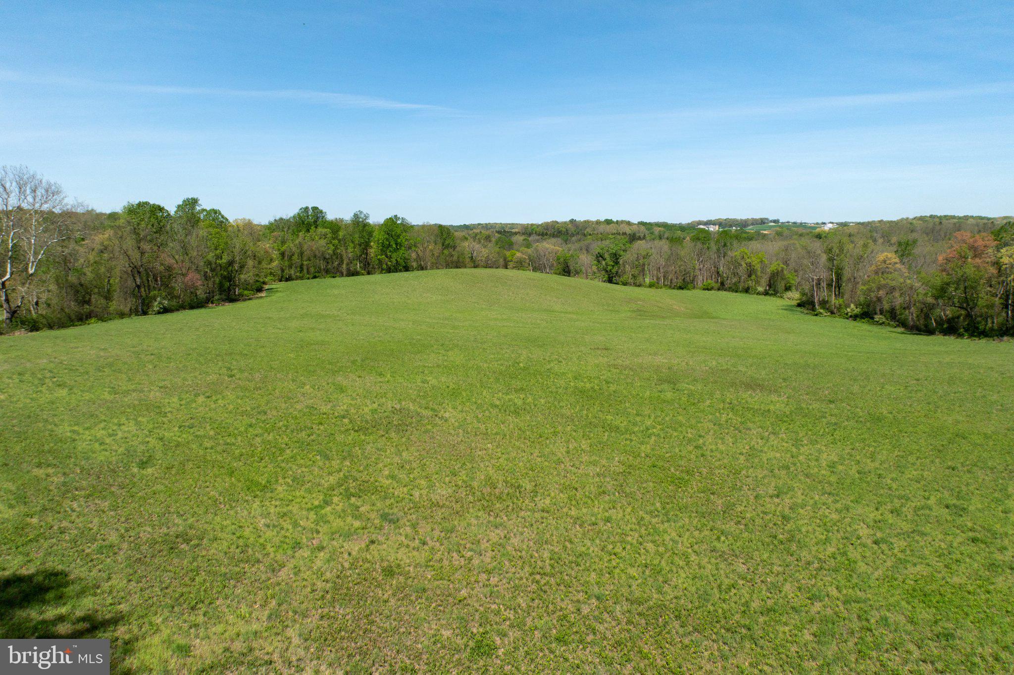 380 Glen Roy Road Nottingham, PA 19362 - Photo 42 of 45 Expansive green landscape under blue skies.