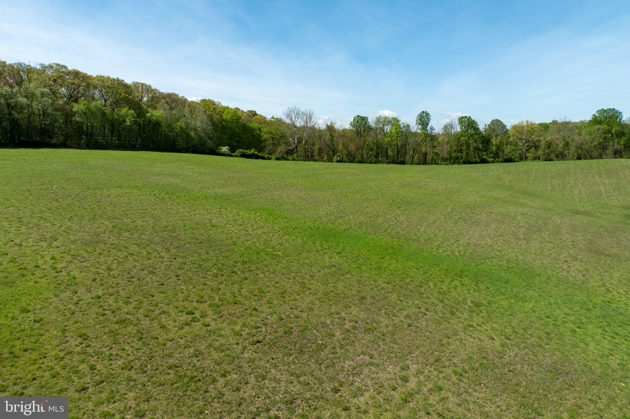 380 Glen Roy Road Nottingham, PA 19362 - Photo 43 of 45 Vast green fields under a clear sky.