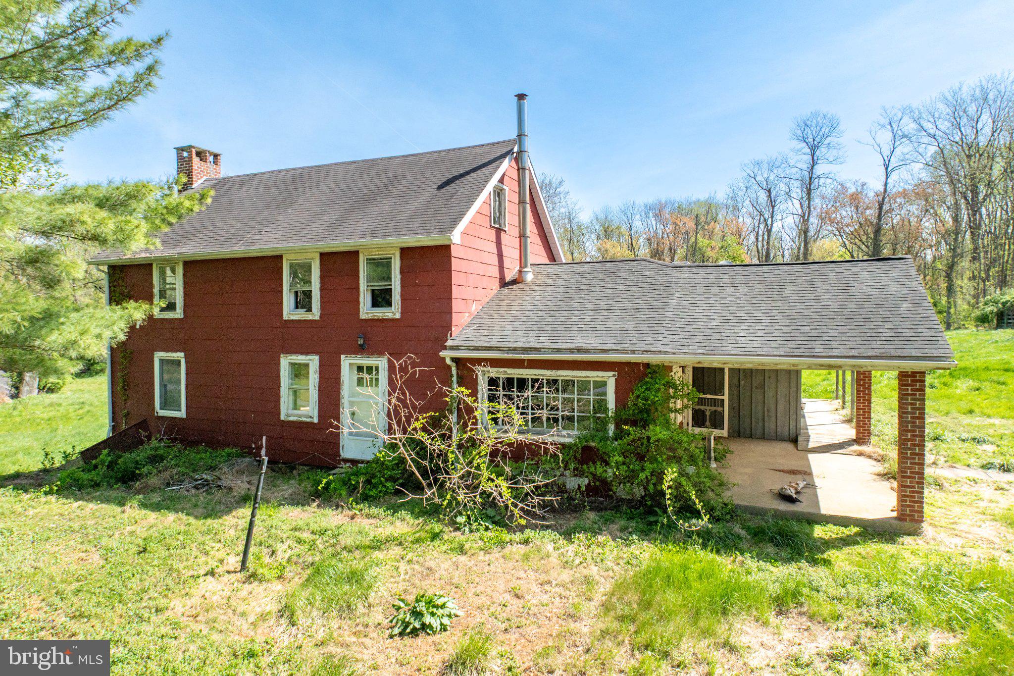 380 Glen Roy Road Nottingham, PA 19362 - Photo 6 of 45 Charming red farmhouse in nature's embrace.