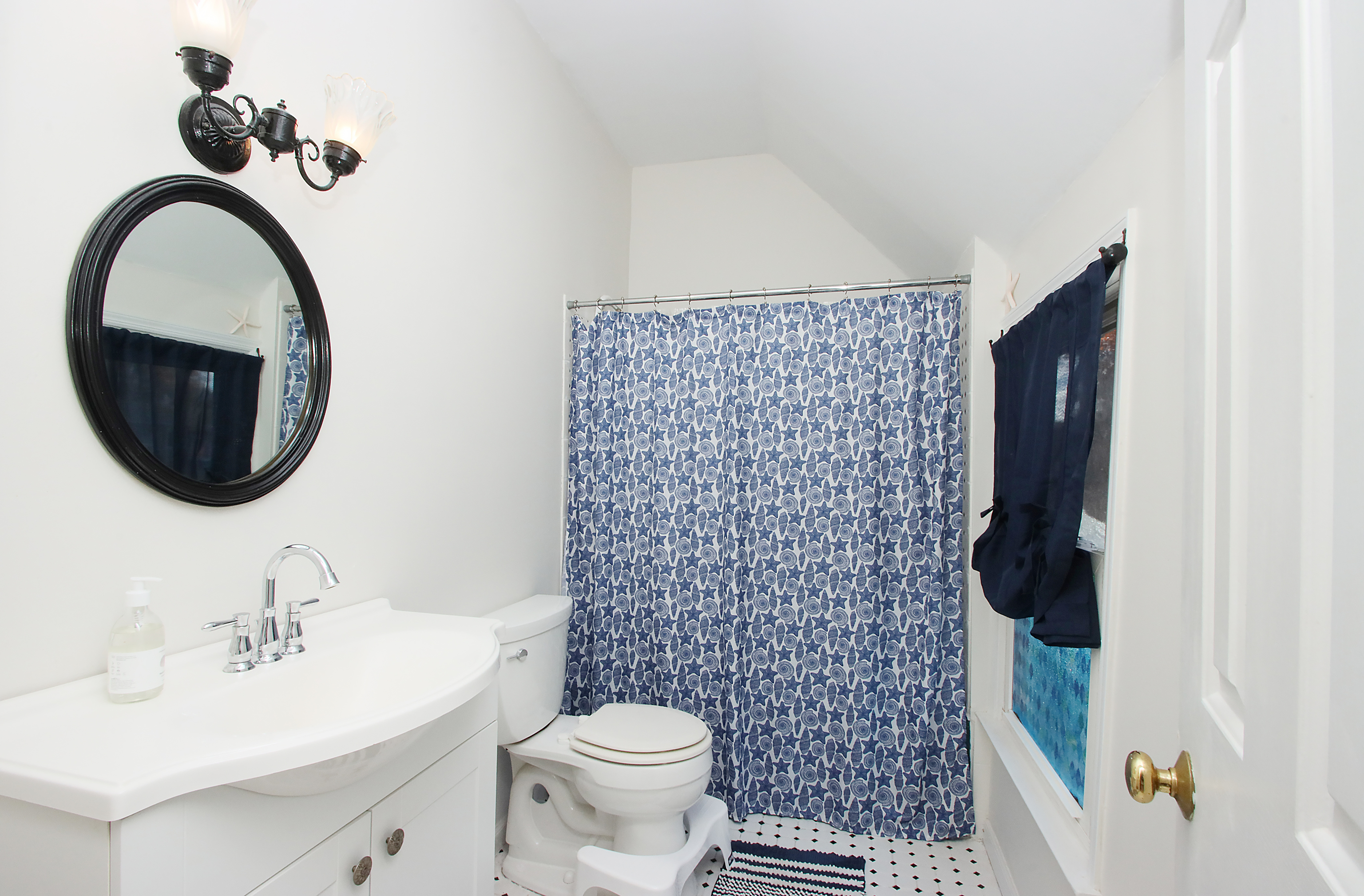 20 Carriage Drive Clinton, CT 06413 - Photo 14 of 31 a bathroom with a sink a toilet and a mirror