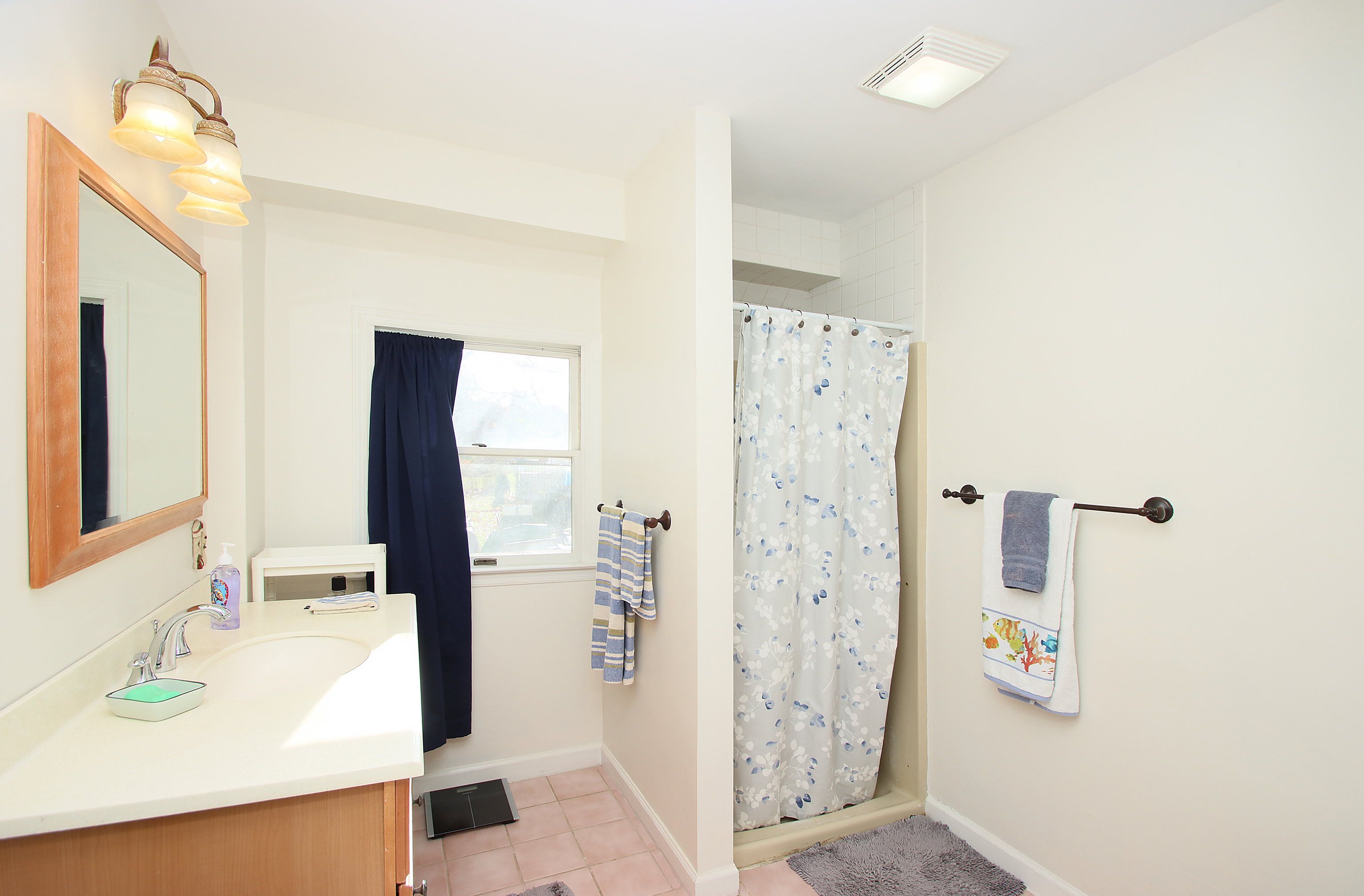 20 Carriage Drive Clinton, CT 06413 - Photo 18 of 31 a bathroom with a granite countertop shower sink and mirror
