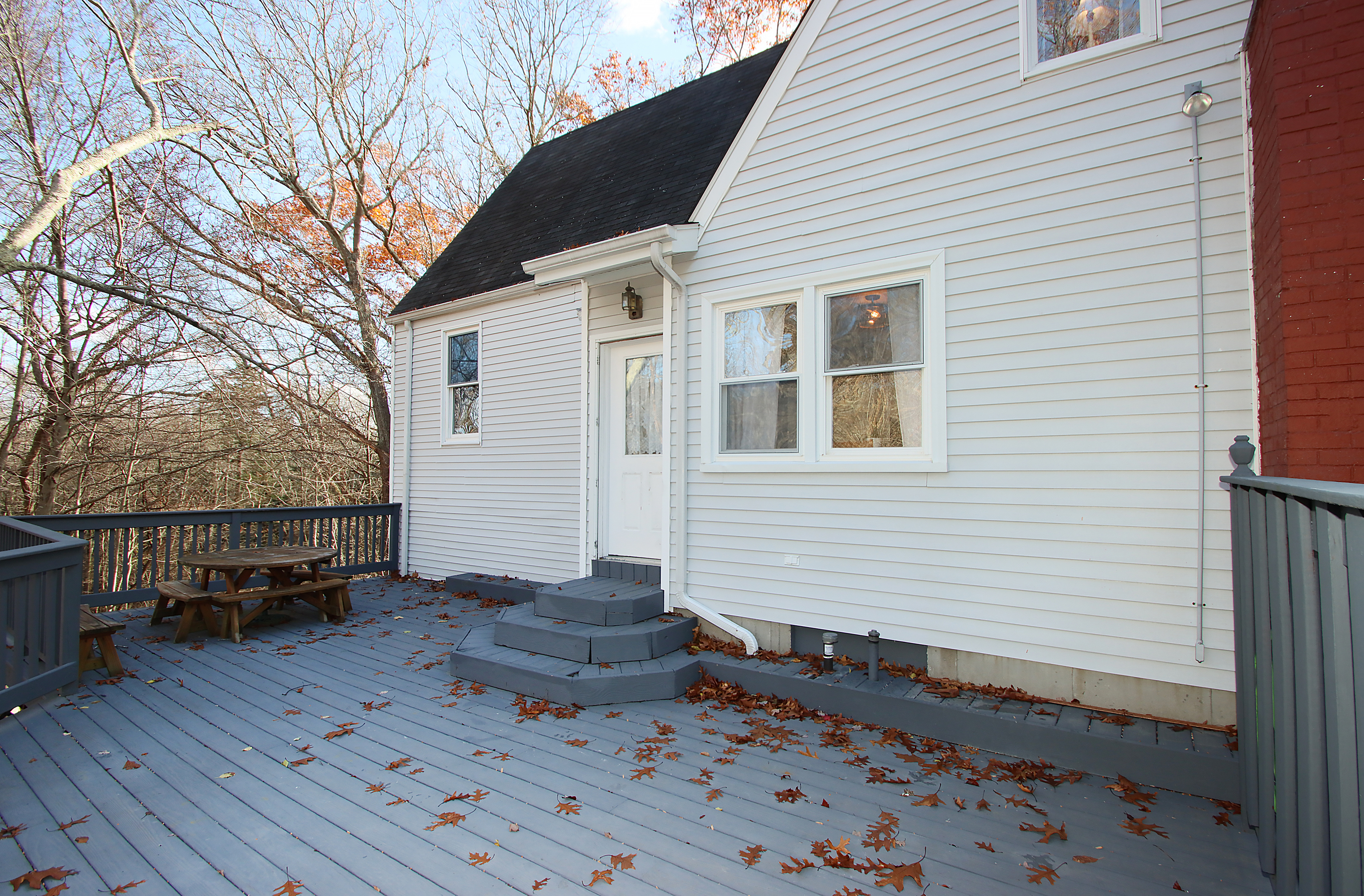 20 Carriage Drive Clinton, CT 06413 - Photo 22 of 31 a view of a house with a wooden bench