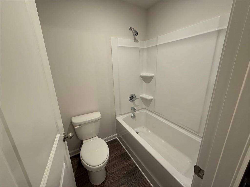 5151 Longview Run Decatur, GA 30035 - Photo 13 of 16 a white toilet sitting next to a bath tub